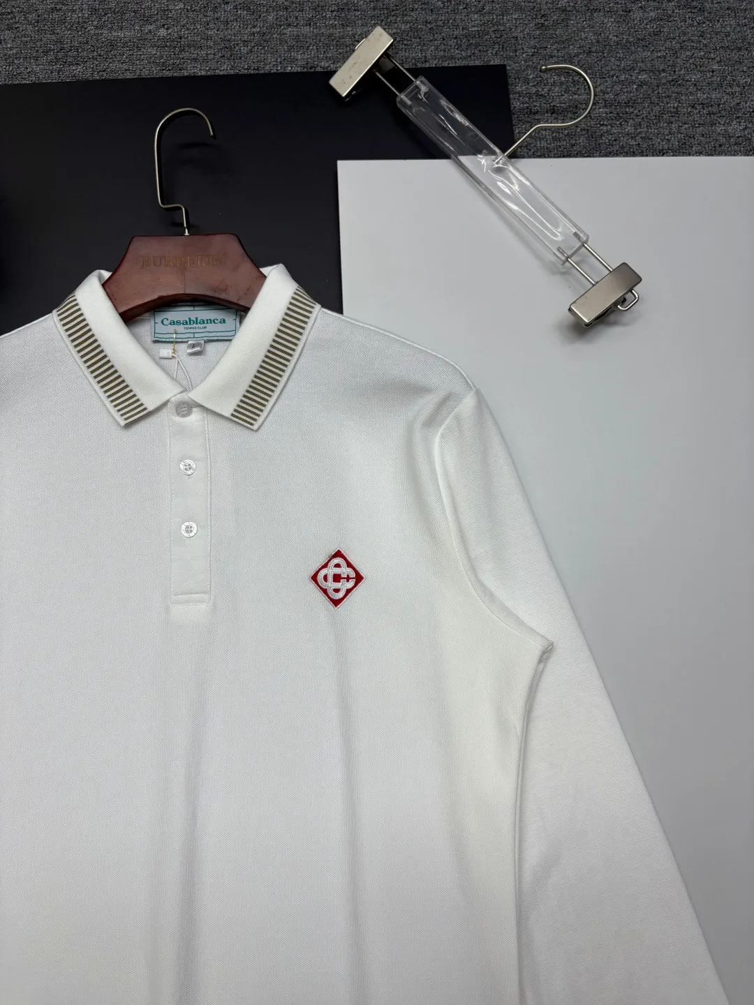 CASABLANCA New Arrival embroidered long-sleeved Polo shirt. Original fabric. Official Same Style. Made of pure cotton pique fabric, customized in the same vat. It feels very comfortable and smooth. The version is very wide and stylish. Produced by the first-line brand Factory. Imported Behringer embroidery machine. The embroidery is full and textured. The collar rib is woven with imported yarn. It will not deform after long-term wear. The most New Arrival style in spring and summer. Fashionable and individual. Super Versatile and good-looking. It is very suitable for both men and women. It is a must-have for everyone. Color: Black White Blue Size: M-3XL